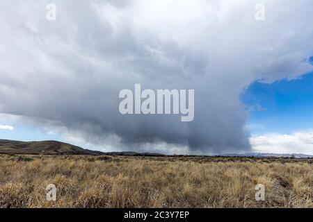 USA, Idaho, Picabo, Storm clouds over fields Stock Photo