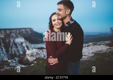 Ukraine, Crimea, Young couple hugging near canyon Stock Photo
