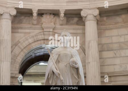 Queen Victoria statue inside Victoria memorial in Kolkata. Majestic on a marble pedestal, statue sculpture art by Thomas Brock. Victoria Memorial Hall Stock Photo