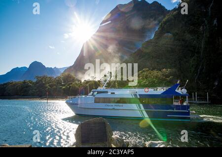 Milford Sound, Fiordland, New Zealand, June 20 2020:Tourists on board a cruise boat heading out into Milford Sound to explore the fjord Stock Photo