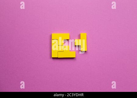 Yellow wooden blocks on pink background. Creative thinking, idea, problem solving, success concept. top view Stock Photo