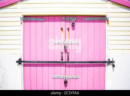 Distressed Vintage Pink Beach Hut Stock Photo