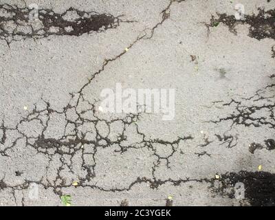 Asphalt background with cracked texture. Stock Photo