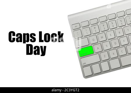 CAPS LOCK DAY text and computer keyboard on white background. Holiday and Technology concept Stock Photo