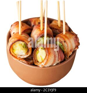 Bacon wrapped brussels sprouts served with cherry tomatoes in ceramic bowl. Appetizer rolls. Isolated on white background. Stock Photo