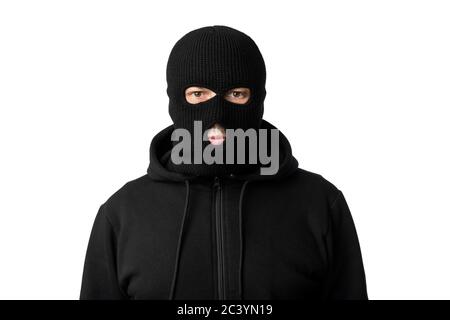 Portrait of masked thief isolated over white studio wall Stock Photo
