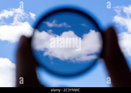 hand holds a circular polarizer filter Accessory for the photographer Stock Photo