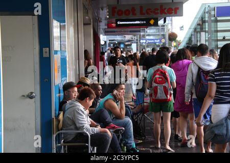 People begin queuing outside Foot Locker on George Street Sydney for the Nike Air Jordan 3 Lab 5’s. Some in the queue wear Air Jordan trainers. Stock Photo