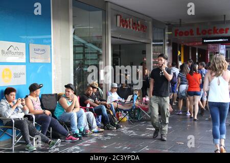 People begin queuing outside Foot Locker on George Street Sydney for the Nike Air Jordan 3 Lab 5’s. Some in the queue wear Air Jordan trainers. Stock Photo