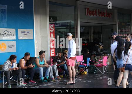 People begin queuing outside Foot Locker on George Street Sydney for the Nike Air Jordan 3 Lab 5’s. Some in the queue wear Air Jordan trainers. Stock Photo