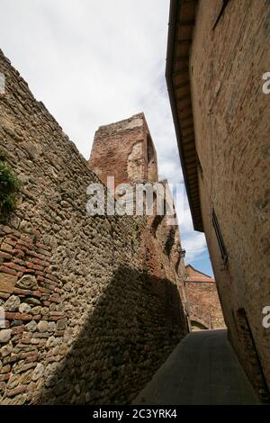 Path over the walls of a typical medieval Italian village, overlooking an ancient bell tower. Traveling Umbria and Tuscany, Italy Stock Photo