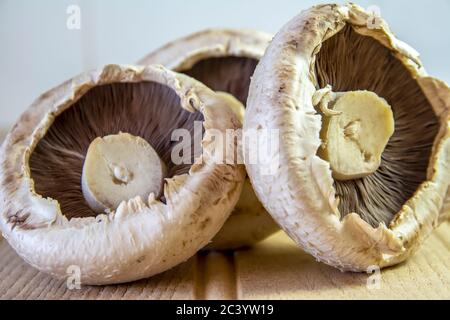 A selection of fresh Breakfast Mushrooms on a wooden table ready to use Stock Photo