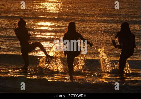 People enjoy the sunshine on Tynemouth beach, as Britain is braced for a June heatwave with temperatures set to climb into the mid-30s this week. Stock Photo