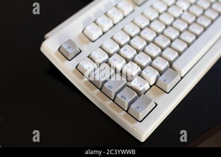 Vintage old computer from the 90u0027s on wooden background Stock 