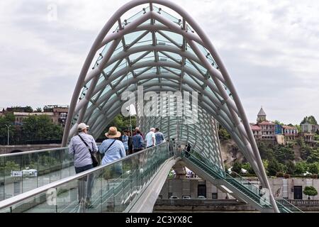 Bridge of Peace, Tbilisi, Georgia, a pedestrian bridge constructed from steel and glass construction illuminated with numerous LEDs, over the Kura Riv Stock Photo