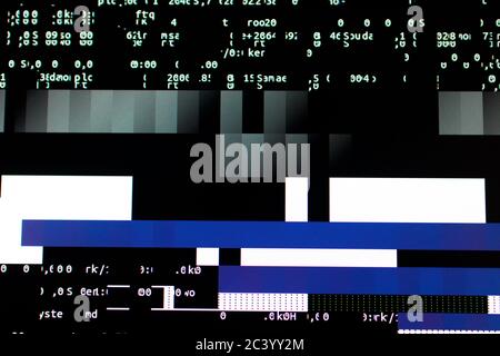 Overloading the graphics card on a computer. Glitches and code on the screen Stock Photo
