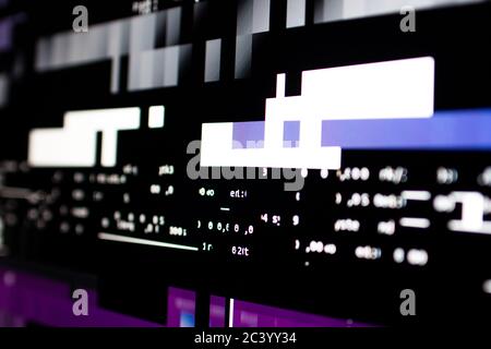 Operating system stalled after a memory overload. Presence of purple and white glitches on monitor and scattered code. System and graphics card lock Stock Photo