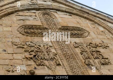 Carved Grapevine Cross on the east façade of the Church of the Assumption, Ananuri Fortress, (16th – 17th centuries), Georgia Stock Photo