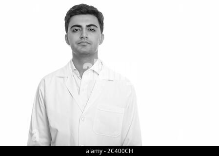 Portrait of young handsome Persian man doctor Stock Photo