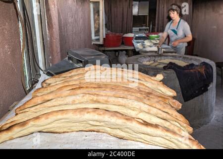 Traditional bread baking and selling by local woman, Georgia Stock Photo