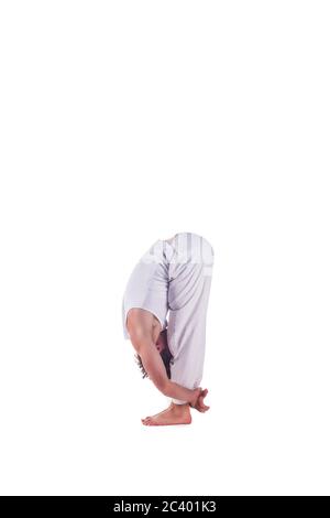 Man practicing yoga doing the " Standing Forward Bend " posture. Uttanasana Stock Photo