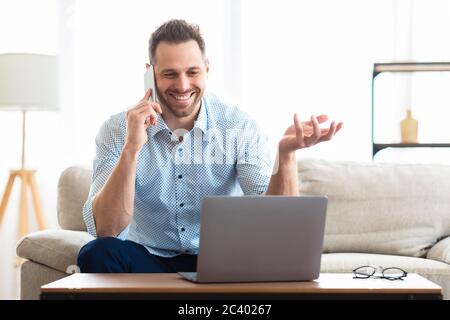 Portrait of happy young man calling his friend Stock Photo