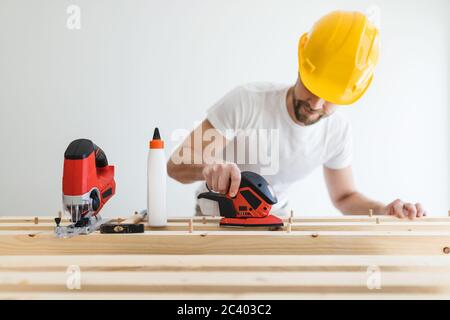Male carpenter working on a project in his workshop Stock Photo