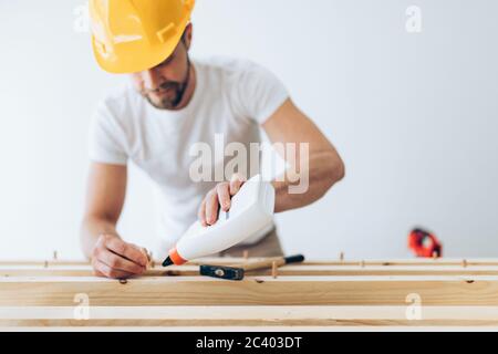 Male carpenter working on a project in his workshop Stock Photo