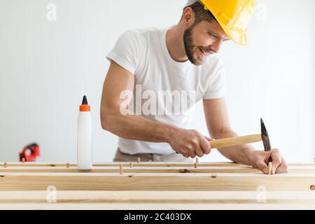 Male carpenter working on a project in his workshop Stock Photo