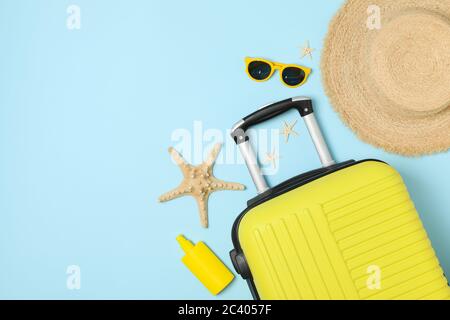 Travel accessories on blue background, top view. Travel blogger Stock Photo