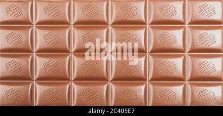 Different chocolate bars on whole background. Sweet food Stock Photo