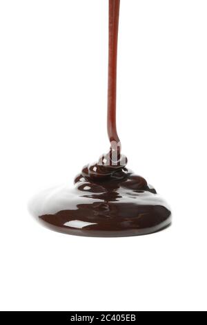 Melted chocolate is pouring, isolated on white background Stock Photo