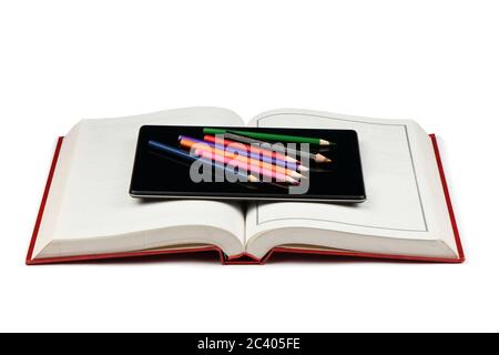 Tablet pc on opened book isolated on white background. High resolution photo. Full depth of field. Stock Photo