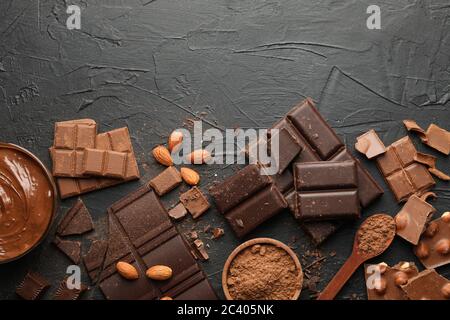 Chocolate, melted chocolate and almond on black background Stock Photo
