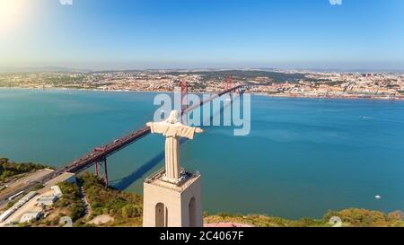 Aerial bridge on April 25th, statue of Jesus Christ Lisbon, Portugal. Historical memo. Close-up.