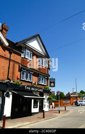 The Bedford public house on corner of High Street and Vale Road, train station in background, Royal Tunbridge Wells, Kent, England Stock Photo
