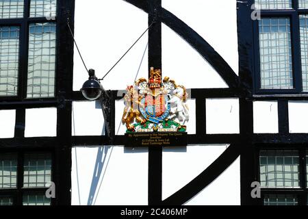 Detail of royal coat of arms on G Collins & Sons jewellers shop (Queen Elizabeth II's Personal Jeweller), High Street, Tunbridge Wells, Kent, England Stock Photo