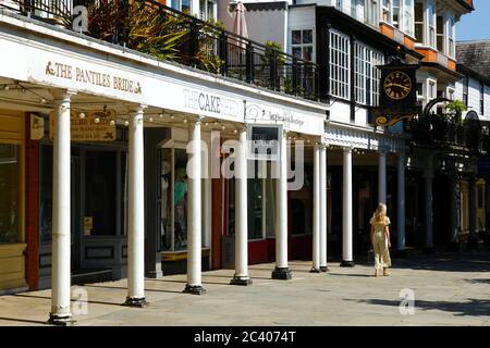 Woman walking past The Pantiles Bride shop, The Pantiles, Royal Tunbridge Wells, Kent, England Stock Photo