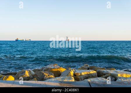 Ship in the Mediterranean sea off the coast of Cyprus. Ships near the port city of Limassol Cyprus. Stock Photo