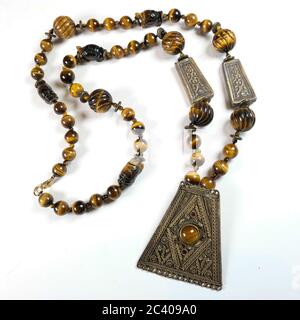 Closeup of a necklace handmade from semi-precious stones Tiger Eye Stock Photo