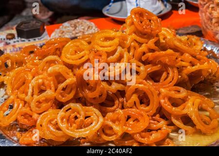 Jalebi is an Indian sweet and delicious food made of Maida flour and sugar syrup Stock Photo