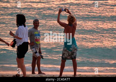 Boracay, Philippines - Jan 23, 2020: Sunset on Boracay island. Sailing and other traditional boats with tourists on the sea against the background of Stock Photo