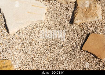 Small gravel and sand wall, grunge texture background, Pebble stone floor tile seamless background, cement mixed gravel pebble stone floor texture Stock Photo