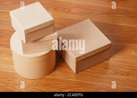 Boxes of parcels on a wooden background, free space. Stock Photo
