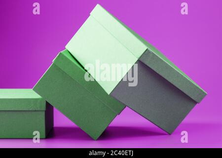 Boxes on a pink background are scattered. Stock Photo