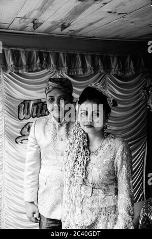 Mount Gede, West Java / Indonesia - June 17, 2010: typical traditional Indonesian Wedding, of the bride and groom portrait. Black and white Stock Photo