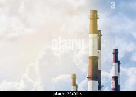 The concept of an environmentally friendly plant without harming the environment and nature. Industrial pipes against the sky. Stock Photo