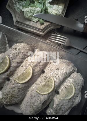 Turkey wings in a marinade with spices for frying. Stock Photo