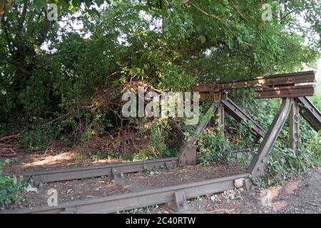 abandoned section of rail track and buffer at twickenham junction rough, former site of twickenham station, twickenham, middlesex, england Stock Photo