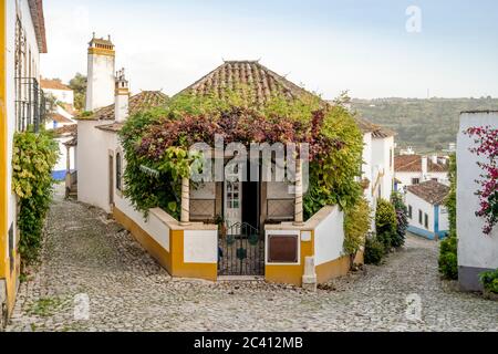 Charming architecture in beautiful town of Obidos surrounded by stone walls, Leiria district, Portugal Stock Photo